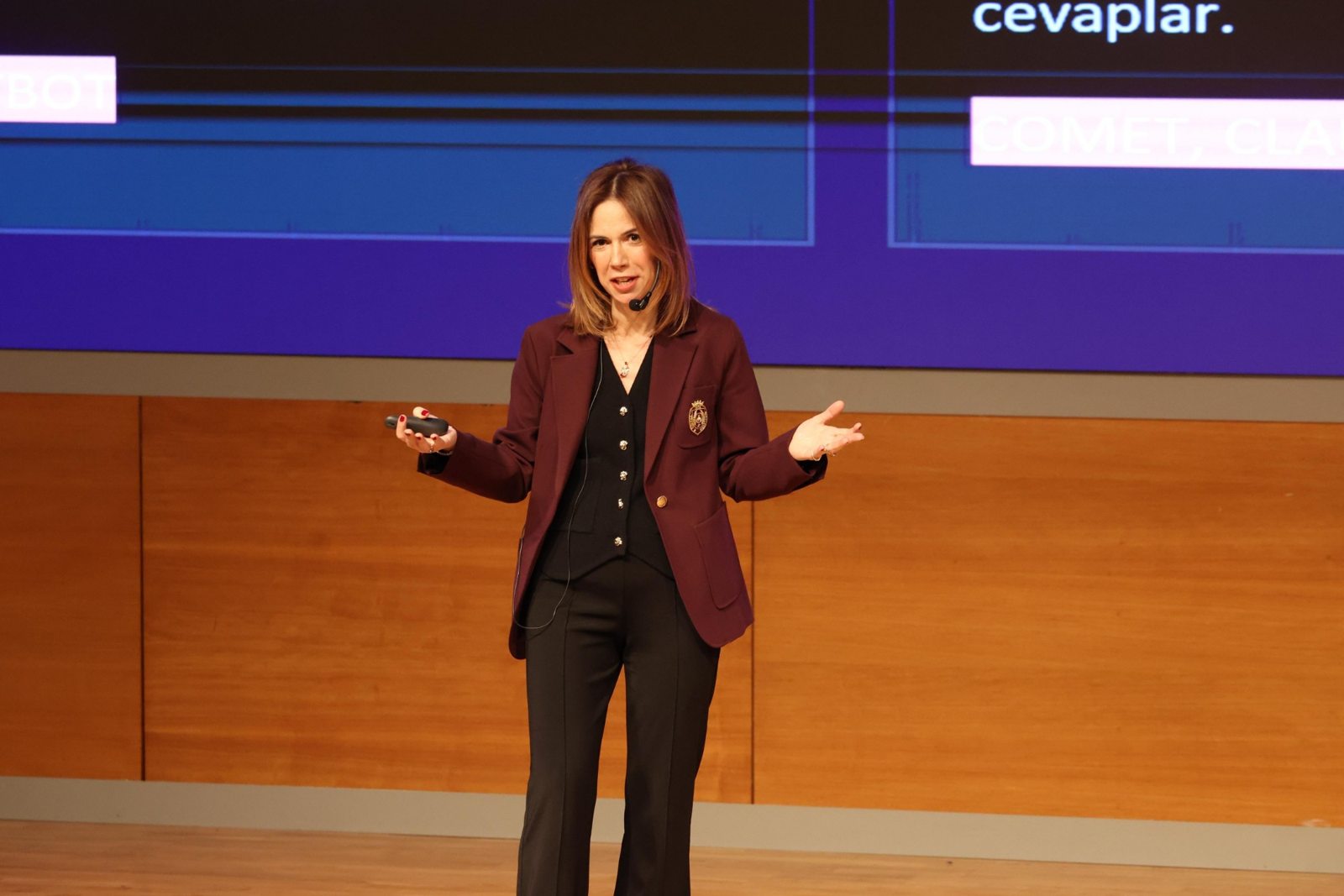 Defne İncekara on stage delivering an enterprise AI training keynote